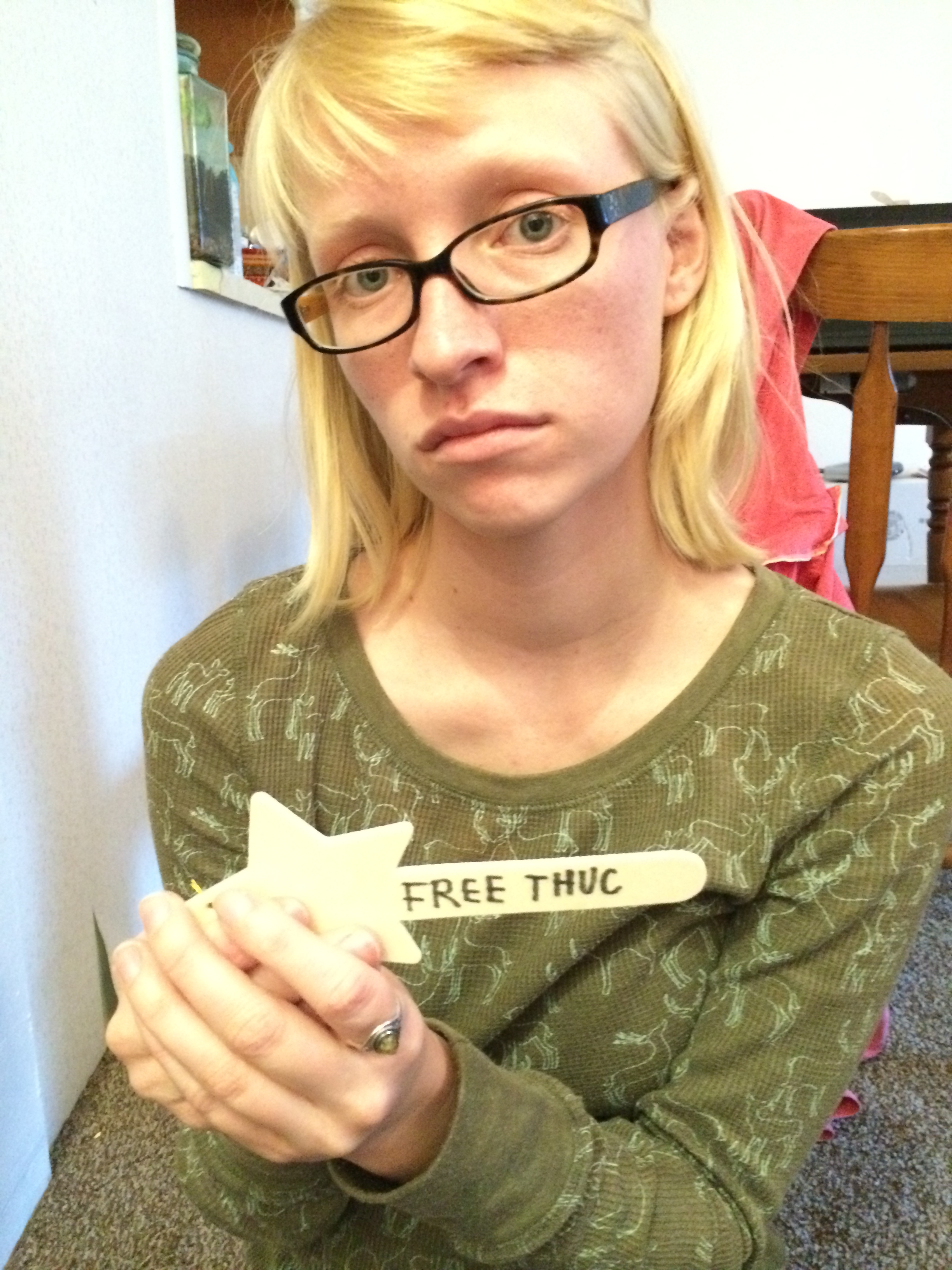 The 88 Project contributor Kaylee Dolen decorating a Christmas tree ornament for Thuc on his birthday